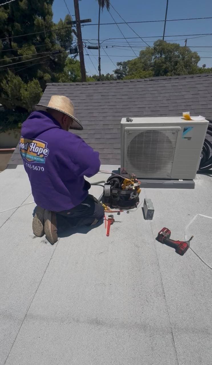 A Good Hope technician performing air conditioning work in Hemet, CA